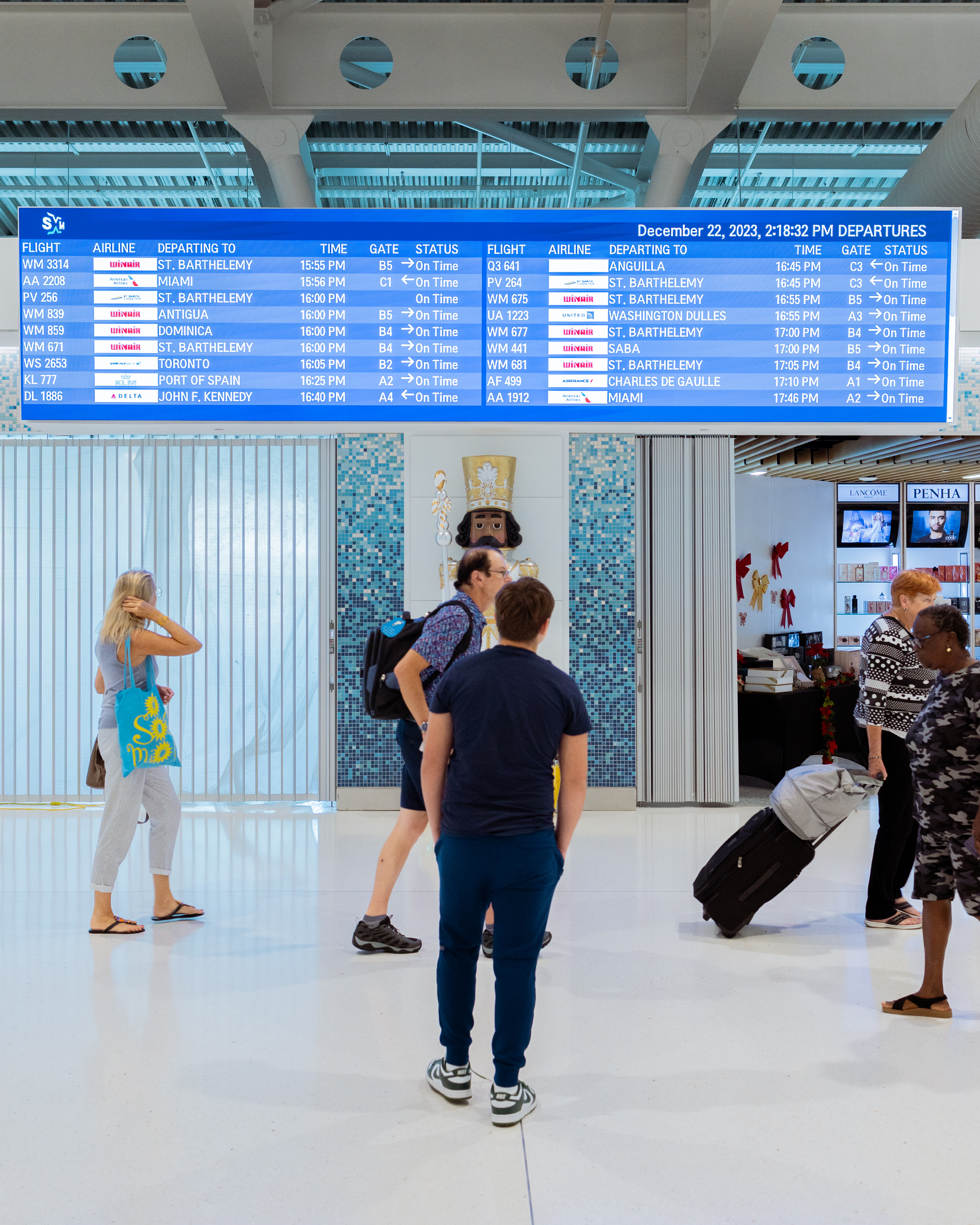 People walking around an airport